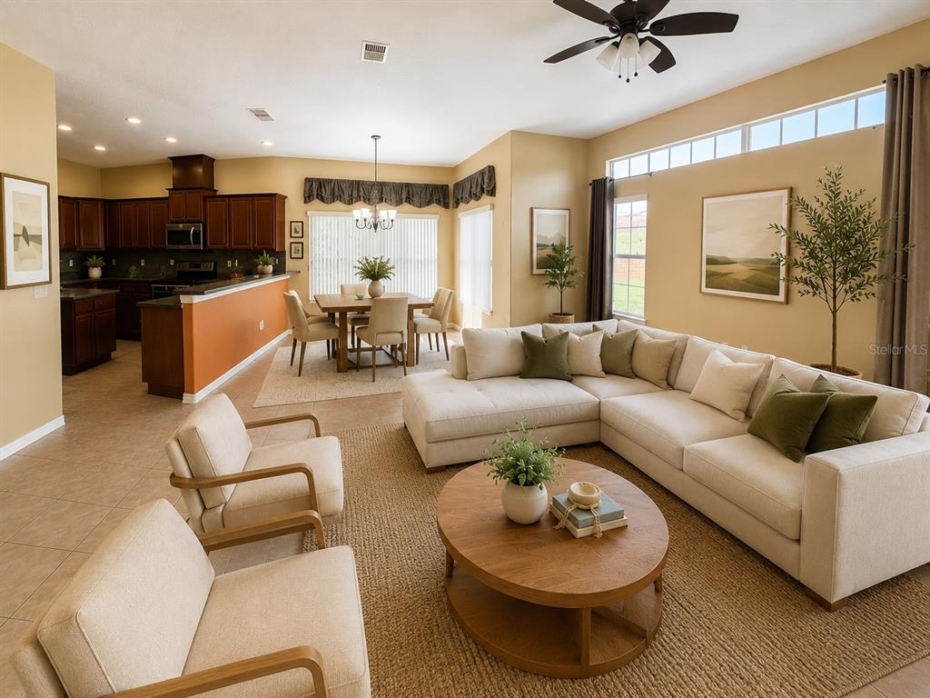 A kitchen features cherry wood cabinets, dark countertops, a center island, and a breakfast bar — 16407 BRISTOL LAKE CIRCLE, ORLANDO, FL