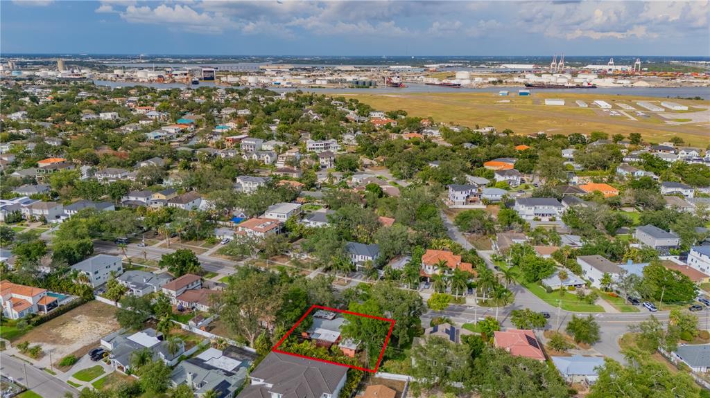 An aerial view shows a residential neighborhood with a red-outlined property in the foreground — 504 W DAVIS BOULEVARD, TAMPA, FL