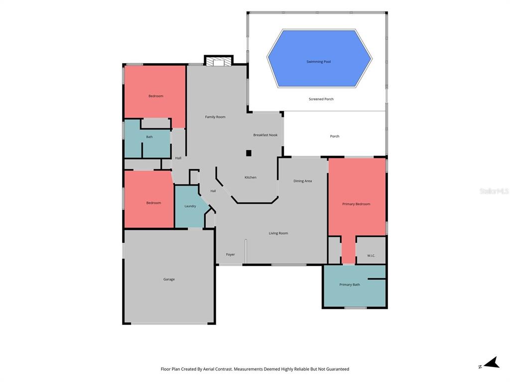 A living room features a gray sectional sofa, a wall-mounted media console, and carpeted floors — 1174 MUSCOVY DRIVE, SPRING HILL, FL