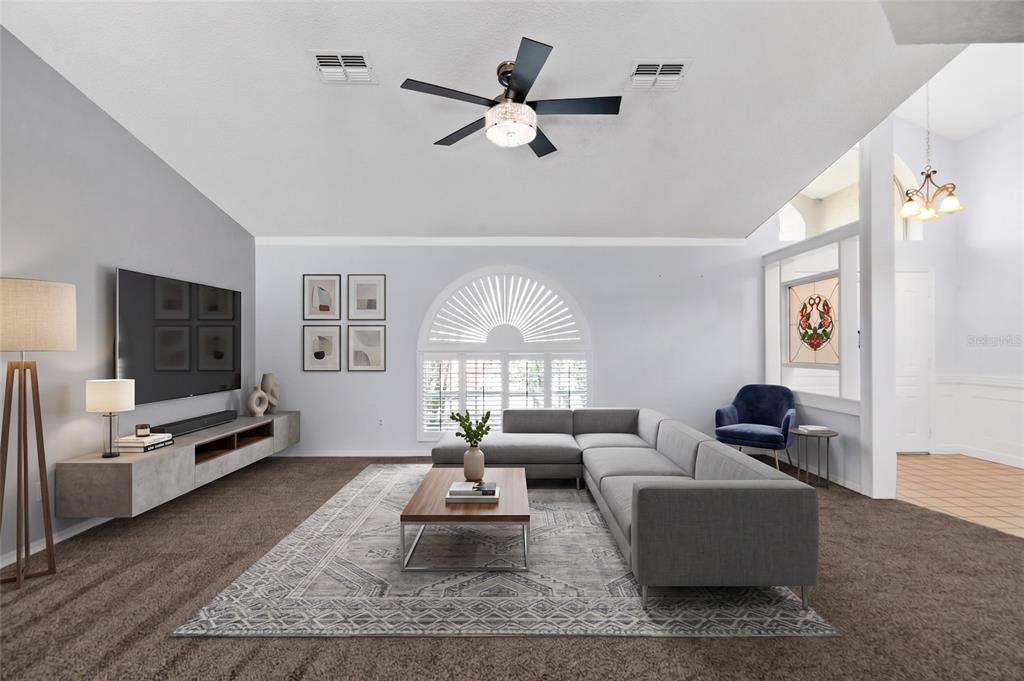 A dining room with a wooden table, six chairs, a chandelier, and a sliding glass door — 1174 MUSCOVY DRIVE, SPRING HILL, FL