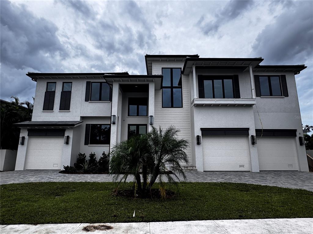 This is a floor plan showing a multi-car garage, living areas, and a bedroom — 626 DANUBE AVENUE, TAMPA, FL