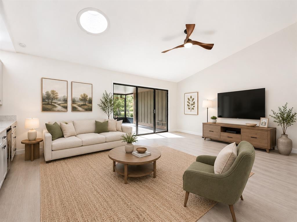 A living room features a beige sofa, green armchair, wooden coffee table, and sliding glass doors — 1353 NELSON COURT, ROCKLEDGE, FL