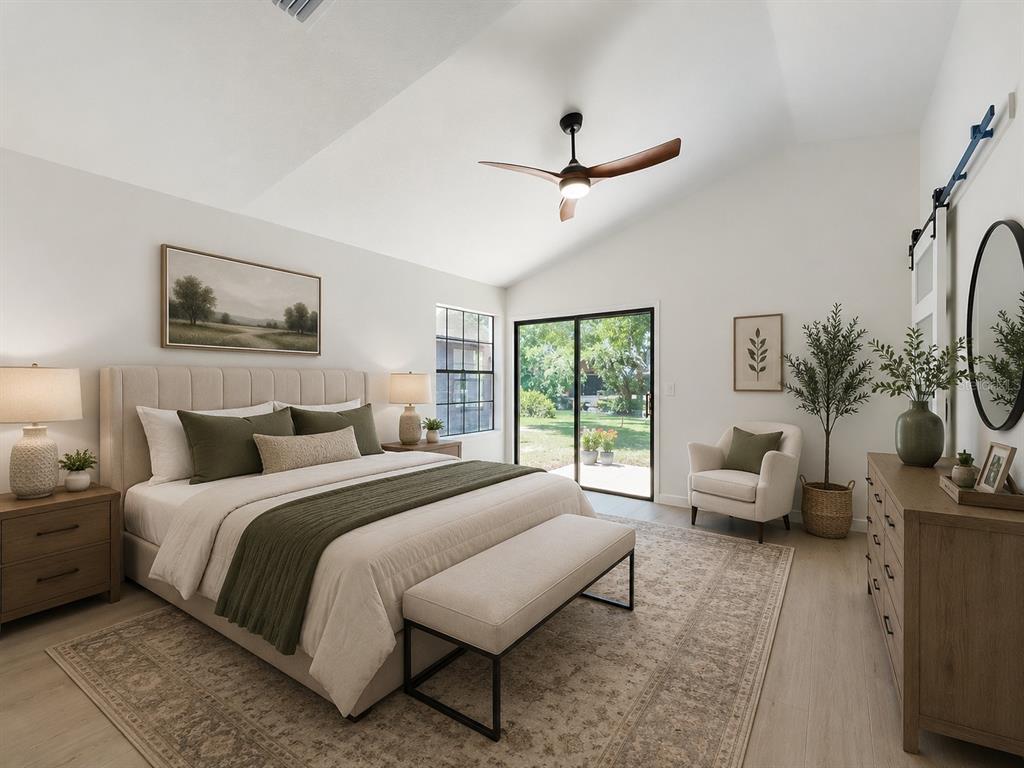 A bedroom features a king bed, a ceiling fan, a sliding glass door, and furniture — 1353 NELSON COURT, ROCKLEDGE, FL