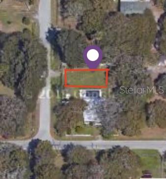 This aerial map view shows a rectangular plot of land highlighted in red — SPIVEY ROAD, GIBSONTON, FL