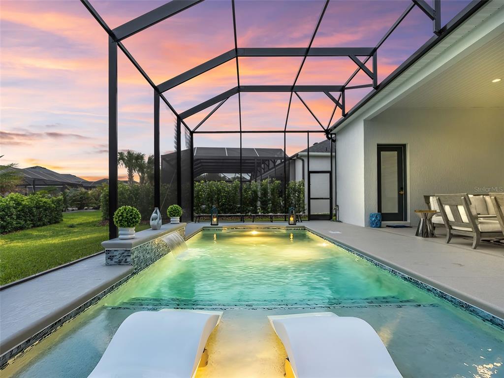 An aerial view shows a single-story house with a gray roof and a concrete driveway — 7095 JENNINGS COURT, THE VILLAGES, FL
