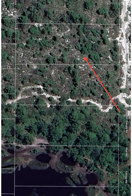 This aerial map shows several wooded land parcels adjacent to a dirt road and water — 5907 CANOPY ROAD, SEBRING, FL