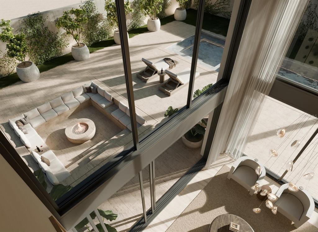 This architectural rendering shows a high-angle view of a modern patio with a fire pit — 46 SERENO, GUAYNABO, PR