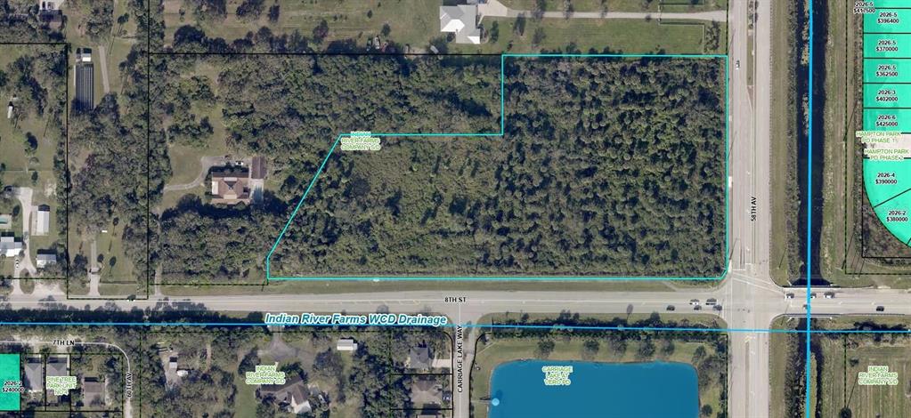 This is an aerial map showing a wooded parcel of land outlined in blue — 5992 8TH STREET, VERO BEACH, FL