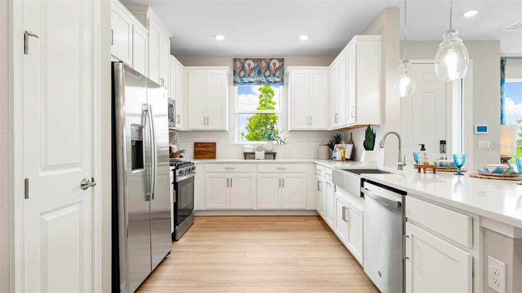 This is a floor plan for a single-story home with a two-car garage and lanai — 13324 SANTINI CIRCLE, ENGLEWOOD, FL