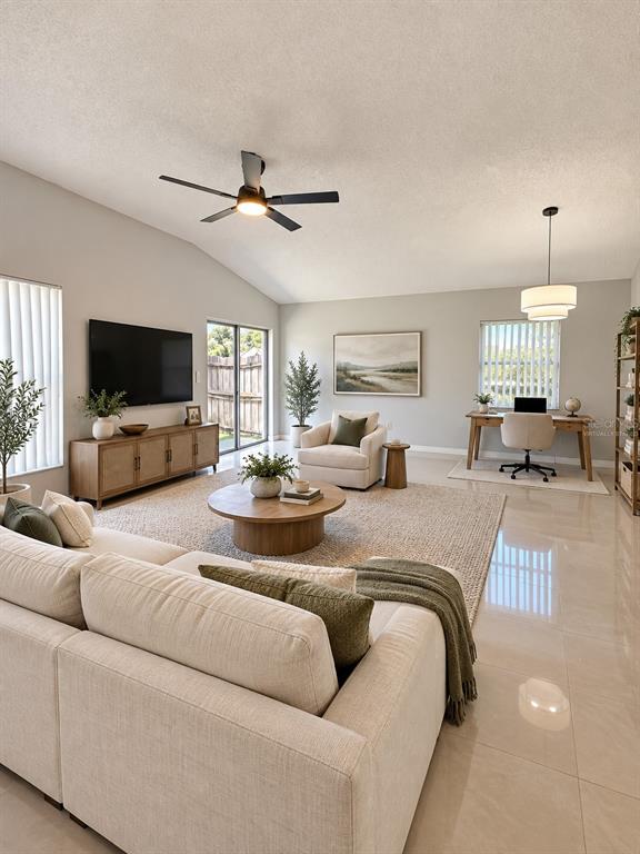 A kitchen with tile flooring, white cabinets, stainless steel appliances, and a dining area — 888 FRANKLIN CIRCLE, PALM HARBOR, FL