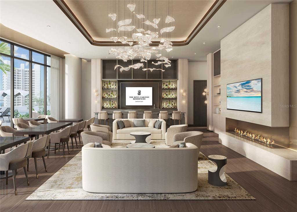 This rendering shows a modern lounge with a bar, fireplace, and seating area — 555 QUAY CMNS UNIT 1603, SARASOTA, FL