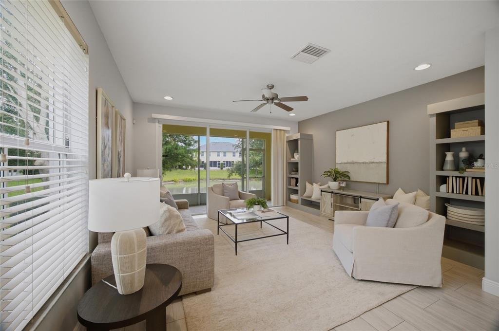 A light-colored front door with a storm door is set within a covered entryway — 485 HARBOR RIDGE DRIVE, PALM HARBOR, FL