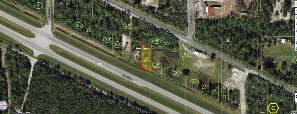 This aerial map shows a highlighted rectangular land parcel located between a highway and road — SR-60, OKEECHOBEE, FL