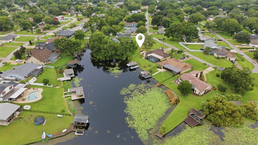 An aerial view shows a residential neighborhood bordering a large lake with a location pin — 22506 SHORESIDE DRIVE, LAND O LAKES, FL