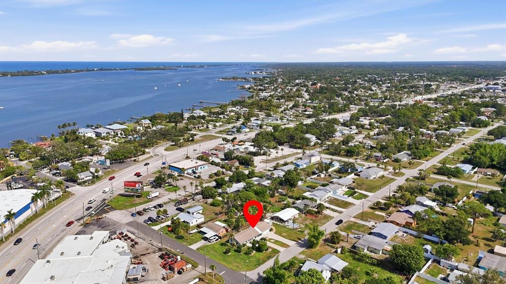 An aerial view shows a residential house marked with a red pin near a waterway — 898 S BROADWAY, ENGLEWOOD, FL