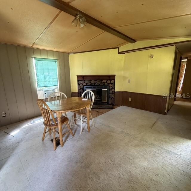 A kitchen features wood cabinets, yellow walls, a white stove, and a large refrigerator — 45600 PANTHER STREET, PAISLEY, FL