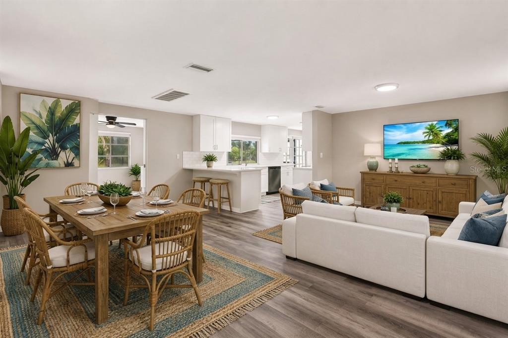 A screened-in patio features a small oval swimming pool, tiled flooring, and various potted plants — 3349 OVERLAND DRIVE, HOLIDAY, FL