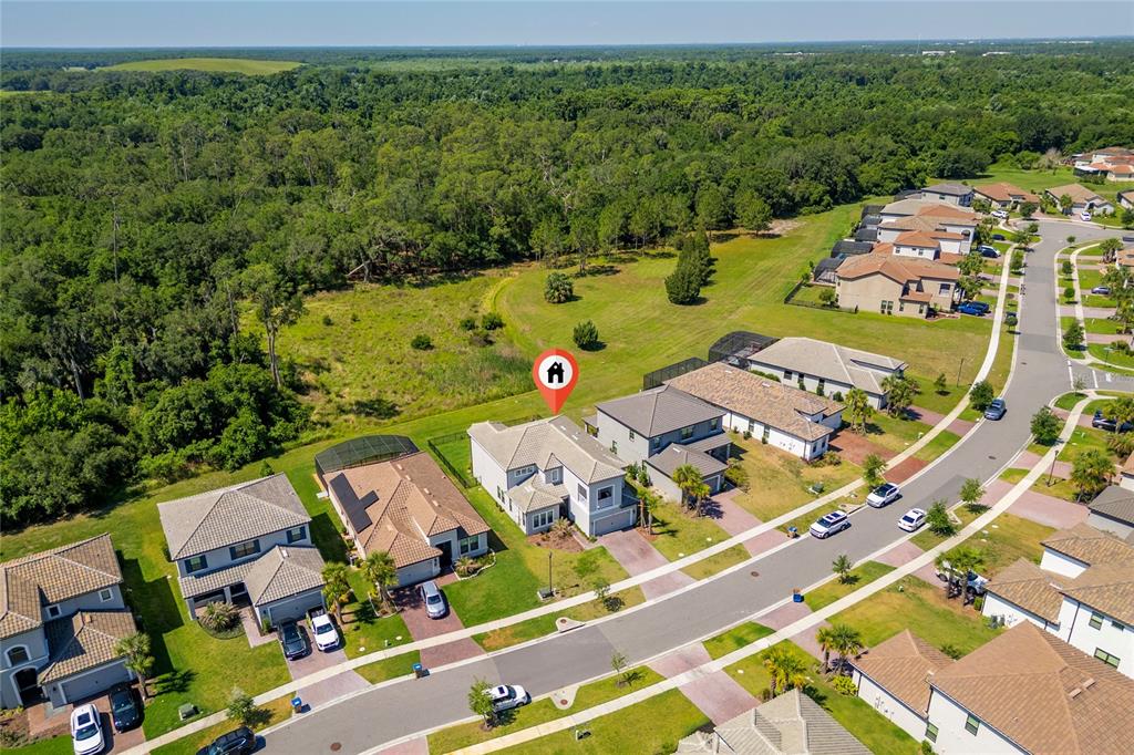 An aerial view shows a suburban house with a red location pin in a neighborhood — 1951 GOBLET COVE STREET, KISSIMMEE, FL