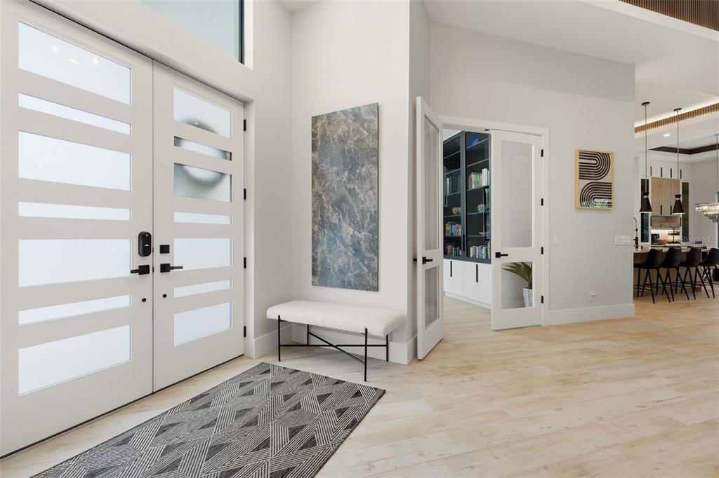 A bright entryway features a double front door, a bench, and a glass-paneled office door — 2462 MISSARA LANE, SARASOTA, FL