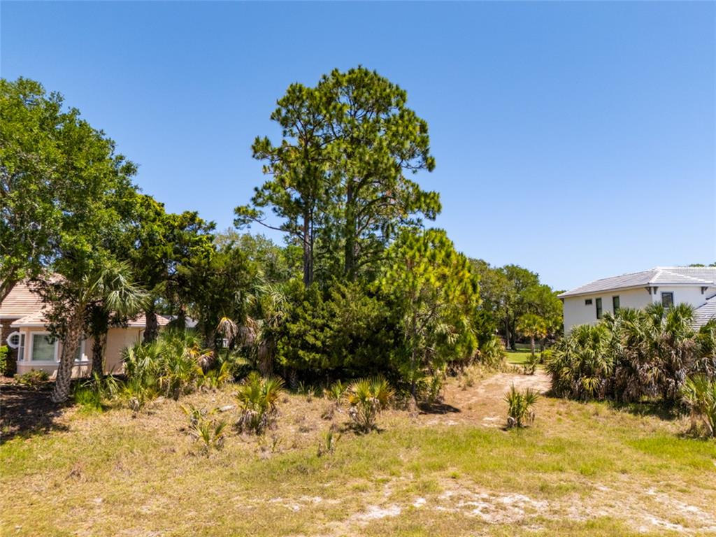 An aerial view shows two houses with pools and private docks along a river — 66 OLD OAK DRIVE S, PALM COAST, FL