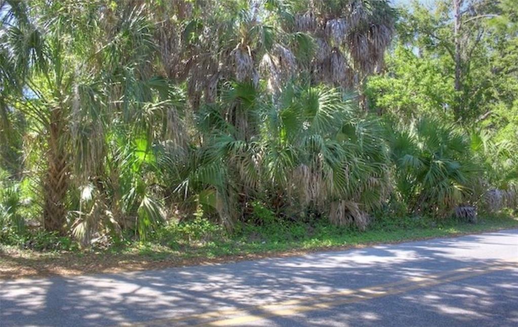 This is an aerial map view of a residential neighborhood located along a lake — Lot 2 SW 165TH AVENUE, CEDAR KEY, FL