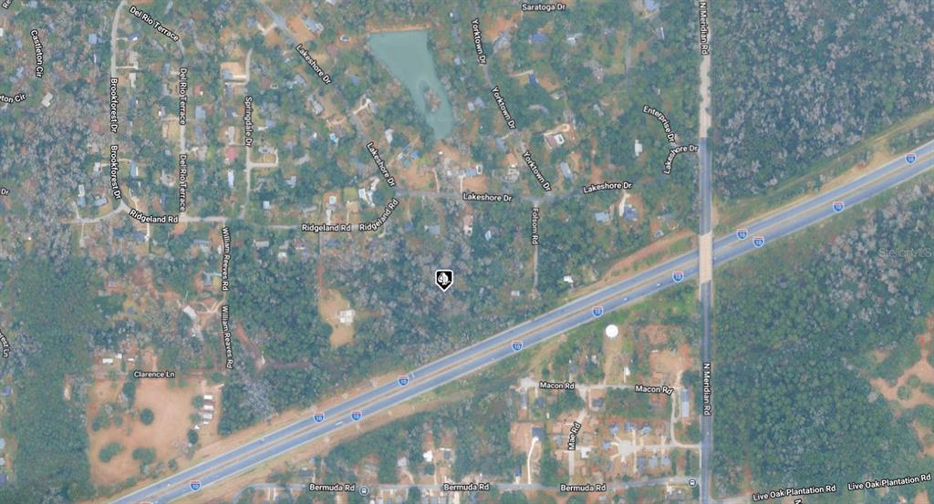 This is an aerial map view showing residential streets and a highway in a wooded area — 21-13-07-000-000.1 FERN HOLLOW ROAD, TALLAHASSEE, FL