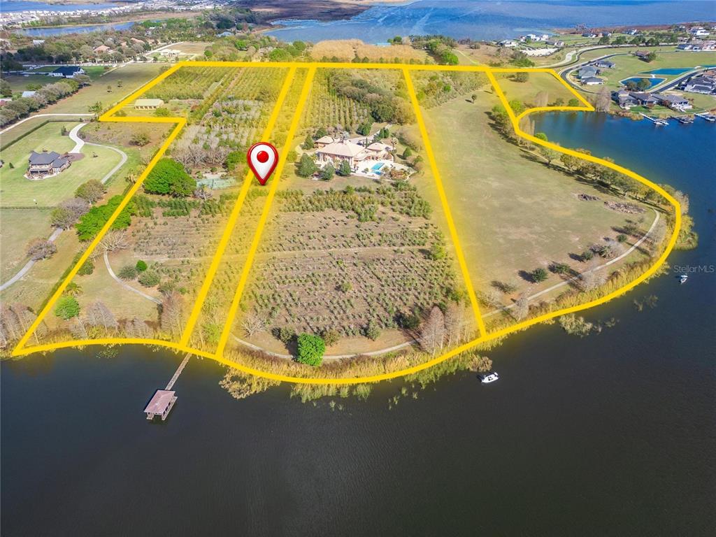 An aerial map shows five adjacent land parcels along a road and a lake — ADAMS BARN ROAD, AUBURNDALE, FL