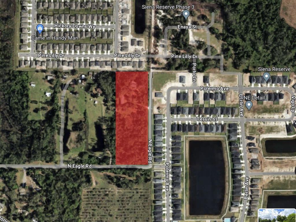 An aerial map view showing a rectangular parcel of land highlighted in red — 5455 N EAGLE ROAD, ST CLOUD, FL