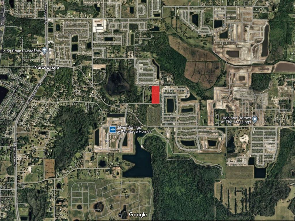 An aerial map view shows a rectangular red-highlighted parcel of land surrounded by residential developments — 5455 N EAGLE ROAD, ST CLOUD, FL
