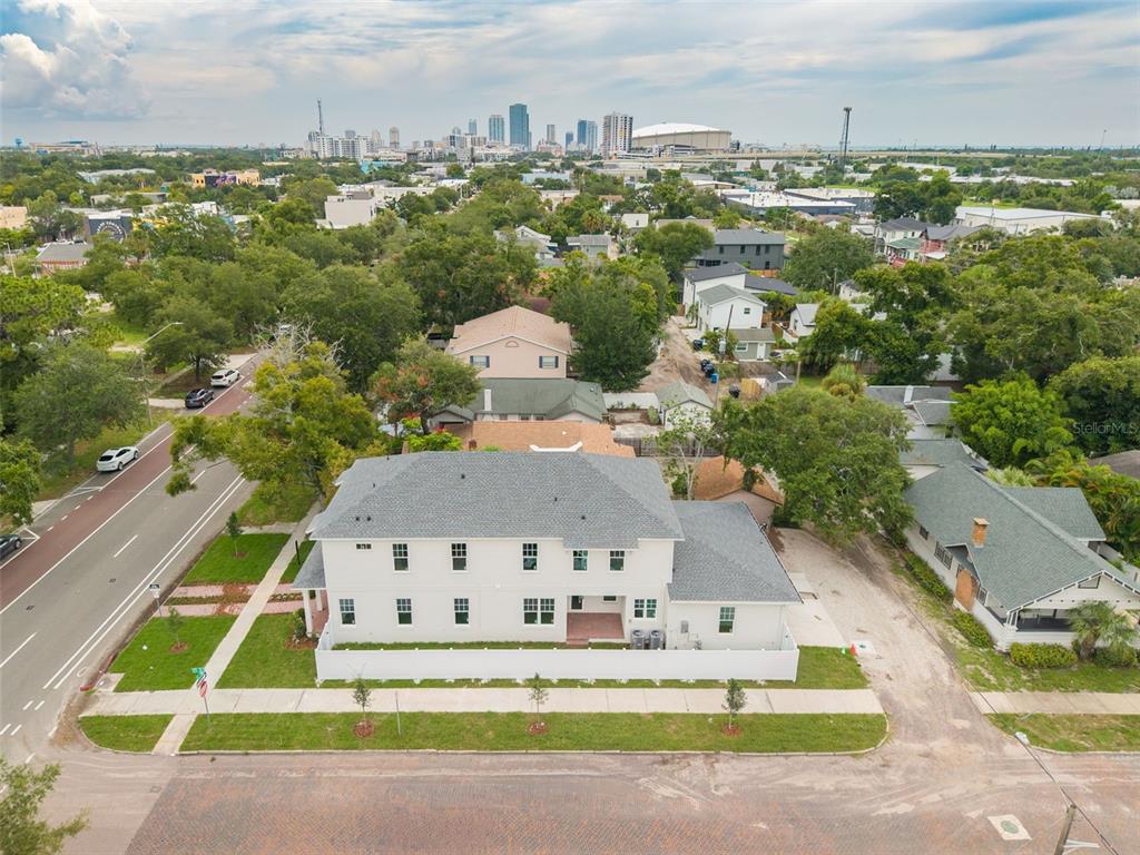 A brick patio with steps leads to a glass door on the side of a house — 2460 1ST AVENUE S, ST PETERSBURG, FL