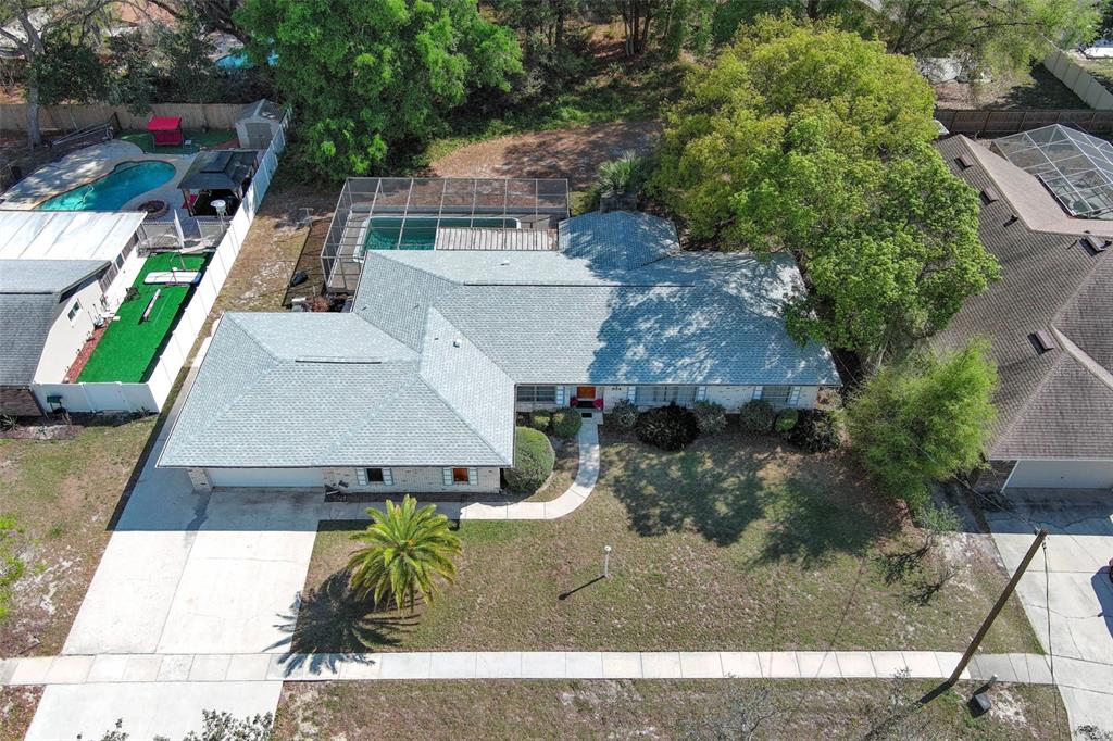 A single-story brick house with a palm tree and a large front lawn — 504 RIDGEWOOD STREET, ALTAMONTE SPRINGS, FL