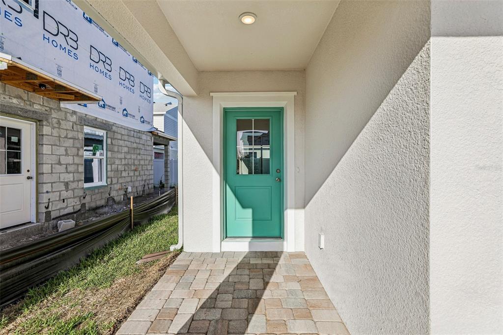This is a floor plan for the first level of a house with a garage — 2720 MEADOW CREST DRIVE, ST CLOUD, FL