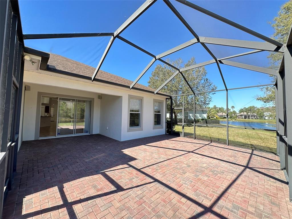 A single-story house with a white exterior, a front porch, and an attached garage — 8120 TURKEY HILL COURT, TAMPA, FL