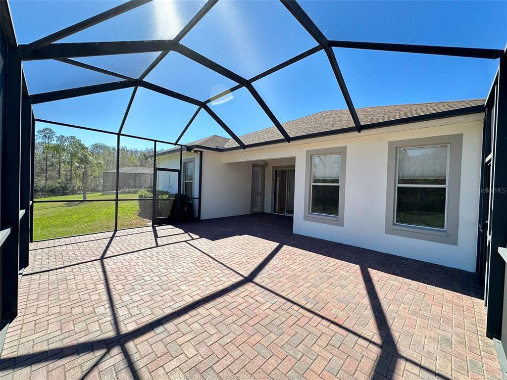 A one-story house with a white exterior, a two-car garage, and a front porch — 8120 TURKEY HILL COURT, TAMPA, FL