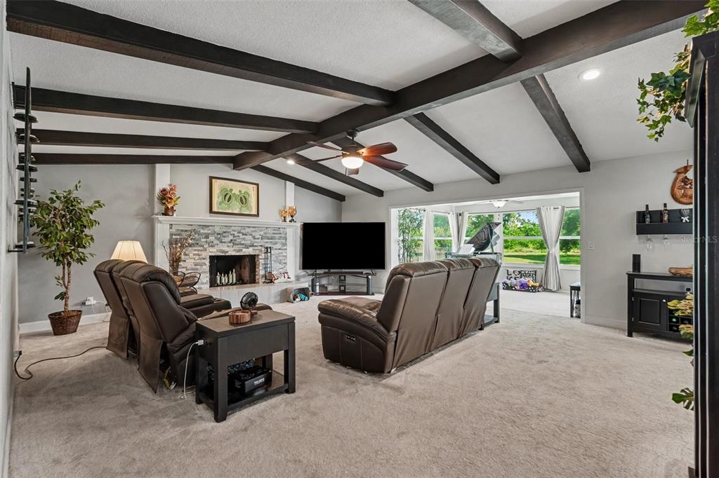 A kitchen with white cabinets, stainless steel appliances, a center island, and a skylight — 12080 66TH AVENUE, SEMINOLE, FL