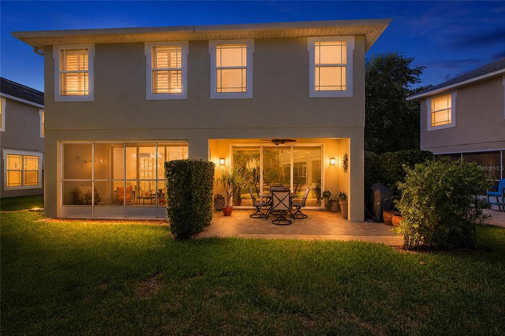 A two-story house with a light yellow exterior and a two-car garage — 477 HARBOR RIDGE DRIVE, PALM HARBOR, FL