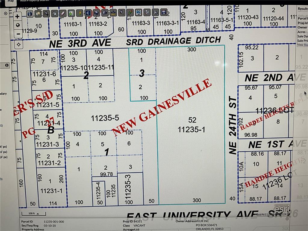 This is a property tax map showing parcel boundaries, street names, and lot dimensions — 2330 E UNIVERSITY AVENUE, GAINESVILLE, FL