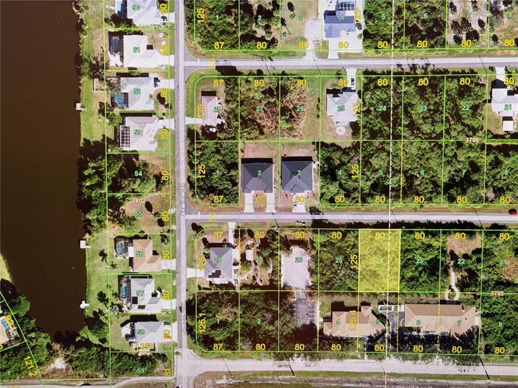 This is a satellite map showing residential lots and houses along a street — 11999 TETZEL AVENUE, PORT CHARLOTTE, FL