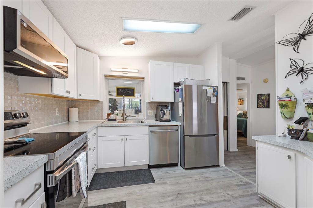 This is a two-bedroom, two-bathroom floor plan with an open living area and a lanai — 2100 KINGS HIGHWAY UNIT 744, PORT CHARLOTTE, FL