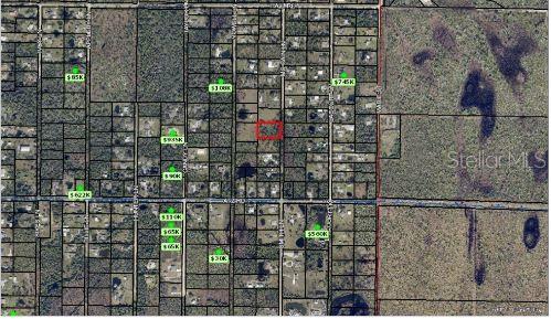This is an aerial map showing property boundaries and land parcels with various price tags — MCCAIN LN, MALABAR, FL