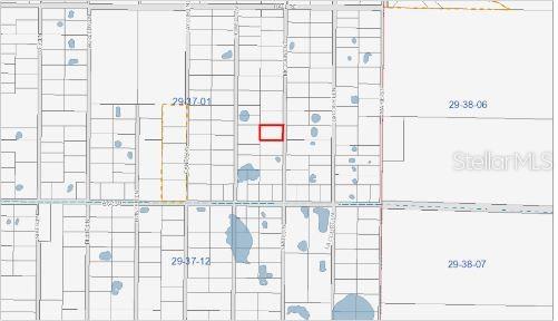 This is a map showing a highlighted rectangular property parcel within a grid of land lots — MCCAIN LN, MALABAR, FL