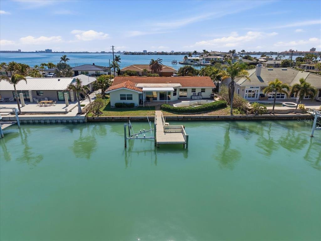 An aerial view of a waterfront house with a private dock and a swimming pool — 411 55TH AVENUE, ST PETE BEACH, FL