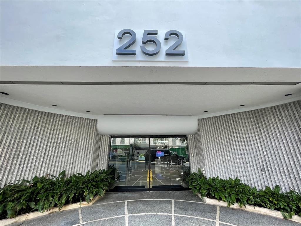 The exterior entrance of a building features the number 252 above glass double doors — 252 PONCE DE LEON AVE, SAN JUAN, PR