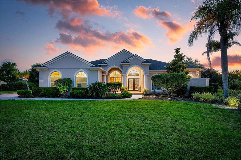 A living room features a grand piano covered by a red cloth and tile flooring — 22610 NIGHT HERON WAY, BRADENTON, FL