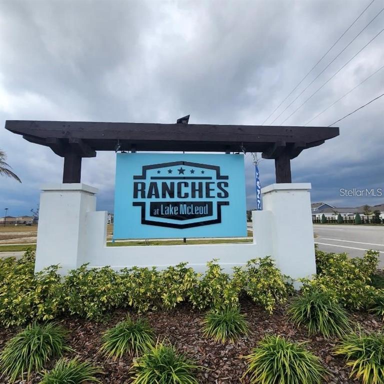 A sign for Ranches at Lake McLeod stands in front of a residential neighborhood — 2189 LASSO LOOP, EAGLE LAKE, FL