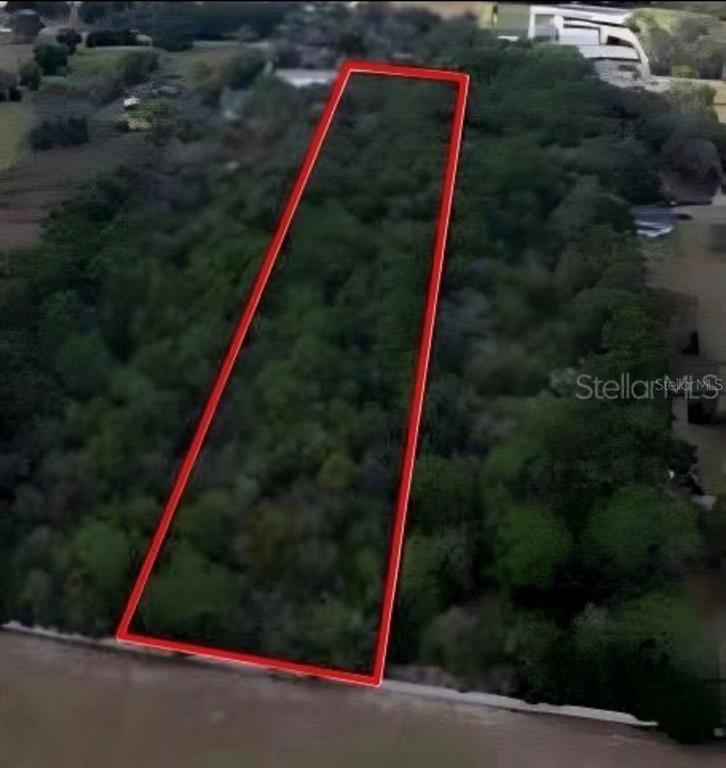 An aerial view shows a rectangular plot of land outlined in red near a body of water — 4327 PLYMOUTH SORRENTO ROAD, APOPKA, FL