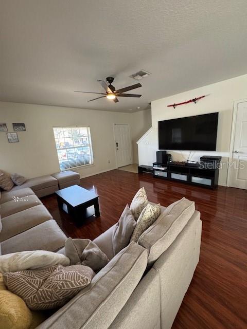 A living room features a sectional sofa, a coffee table, and a wall-mounted television — 4632 CHATTERTON WAY, RIVERVIEW, FL