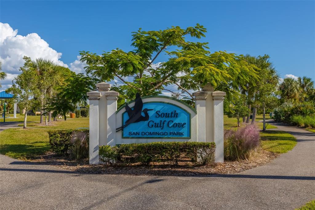 A sign for South Gulf Cove San Domingo Park stands in a grassy outdoor area — 10098 ARMY CIRCLE, PORT CHARLOTTE, FL