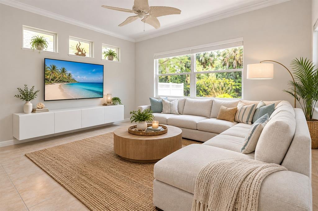 A living room features four curved armchairs, a gold coffee table, and a crystal chandelier — 8150 INDIGO RIDGE TERRACE, UNIVERSITY PARK, FL