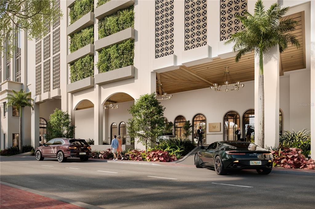 This architectural rendering shows the exterior entrance of a modern building with luxury cars parked — 65 S PALM AVENUE UNIT 1503, SARASOTA, FL